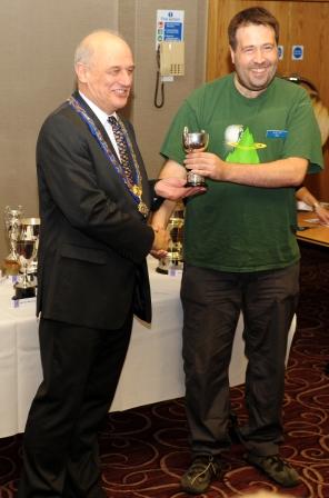 Being presented with the 6m Backpackers Trophy by RSGB President Dave Wilson M0OBW