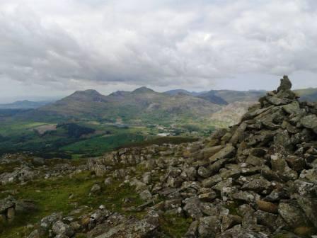 Summit cairn and views across Snowdonia