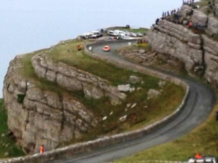 Rally car negotiating the tight bends on the Orme Marine Drive