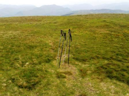 Walking poles place to mark the direction of the vague return path!