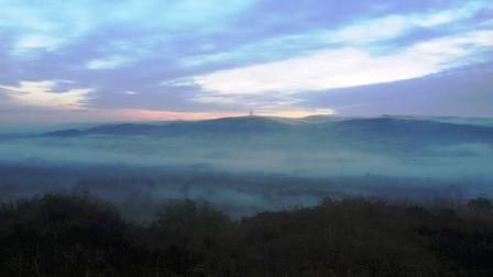 View over a misty Dane Valley to Croker Hill (Sutton Common)