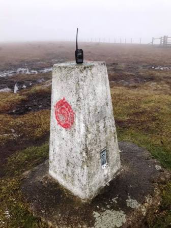 Trig point displaying the red rose of Lancashire