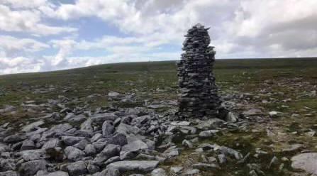 First of several "stone man" cairns onto the summit plateau of Cross Fell