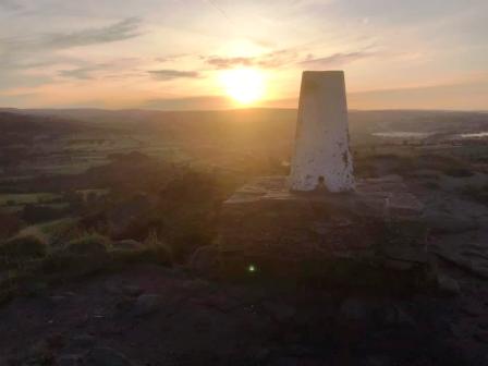 Sunrise behind the trig point