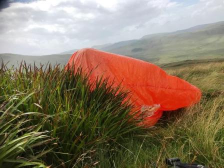 Jimmy in his bothy bag waiting for the rain shower to pass