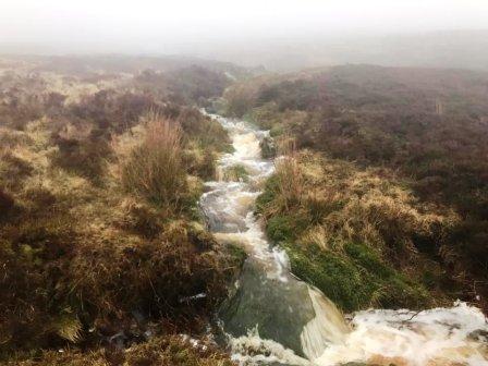 Gushing torrent accompanying the descent