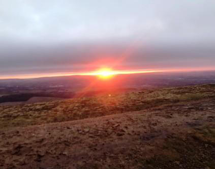 Catching the sunrise from Pendle Hill summit