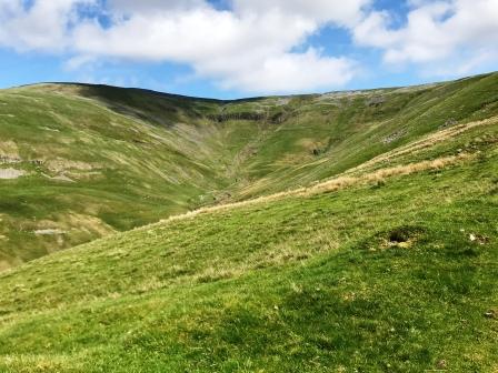 Climbing onto the shoulder of Cross Fell