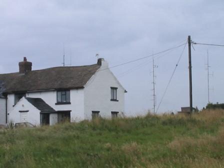 Farmhouse at Bowstonegate, with repeater masts behind