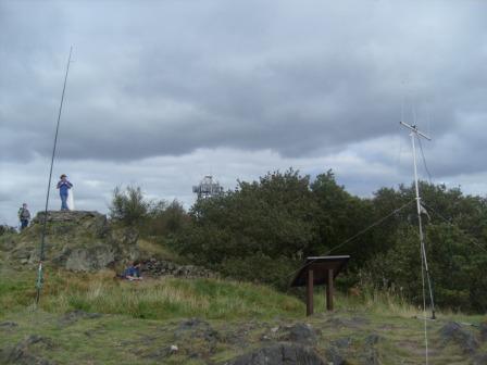 Summit area of Bardon Hill.  Tom M1EYP/P is sat below the trig point working on 20m CW.
