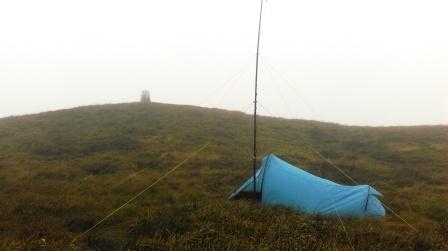 Tent pitched and mast erected close to the trig point