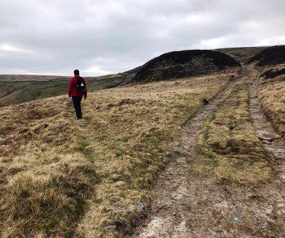 Very subtle left turn onto a faint grassy path