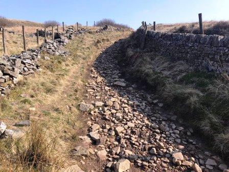 More ascending up a walled track