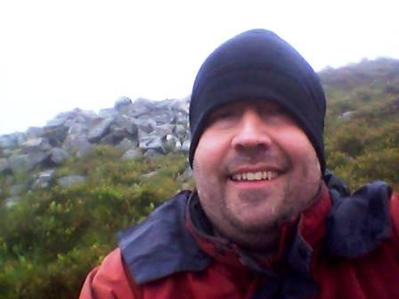Selfie with the actual summit just behind