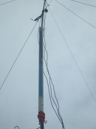 Pole temporarily repaired using botton section as support and tent guys to keep it in place