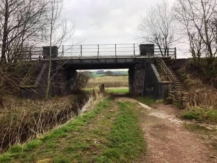 Climb the steps to rejoing the old railway line