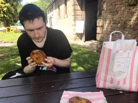 Liam enjoying a jackfruit pie from the bakehouse