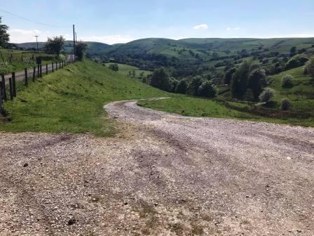 Follow the gravel track nearest to Kishfield Lane, downhill