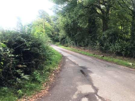 Turning left onto the road near Mere Farm