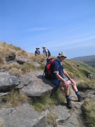 Don on Laddow Rocks, Jimmy and Stuart look on