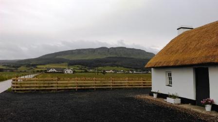Our holiday cottage with Binevenagh towering behind