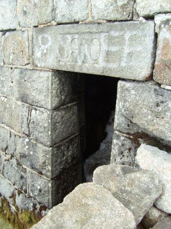The brick shelter under the trig point