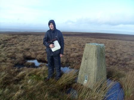 Jimmy arrives at the trig point