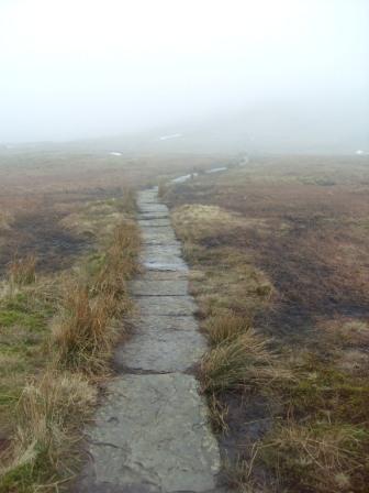 Flagged path approaching the summit ridge