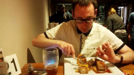 Jimmy enjoying his dinner and beer at the pub