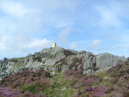 The yellow trig point on Carn Fadryn