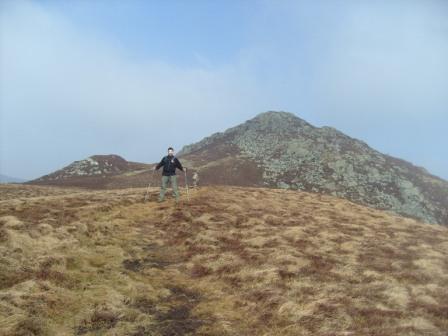 Tom begins the climb from the saddle