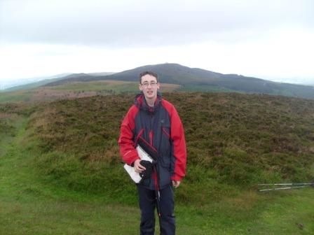 Jimmy on summit, with our next target Moel Famau behind