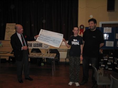 Sir Nicholas Winterton M.P. formally announces the presentation of the fundraising cheque
