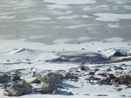 Edge of the frozen reservoir surface