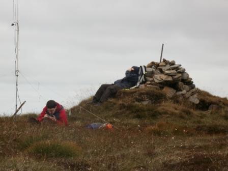 Jimmy M3EYP operating, and Craig resting on the summit cairn