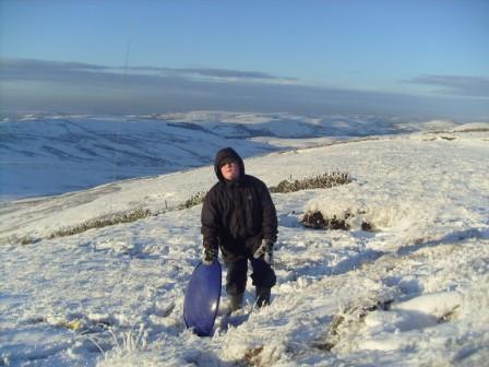 Liam returns after his long long trip down the hill to retrieve his sledge!