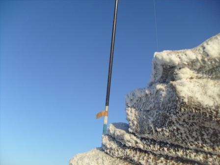 Base of pole on a wintry Shining Tor