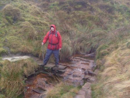 Crossing a stream on the Pennine Way path
