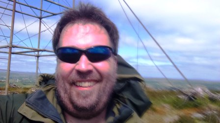 Tom by the fire tower on thel summit