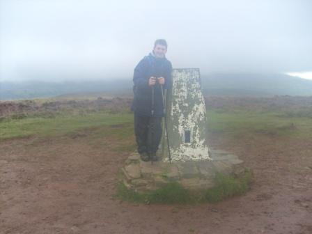 Craig at the nearby trig point, which is actually 9m lower than the summit