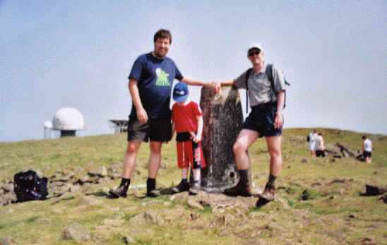Tom M1EYP, Liam & Richard G3CWI, on Titterstone Clee Hill, watched by the ghastly radar installations