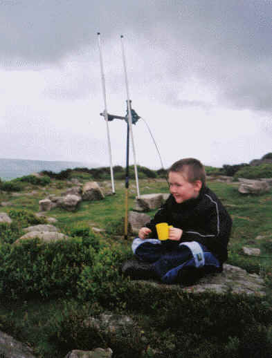 Liam takes a drinks break on the summit of Stiperstones