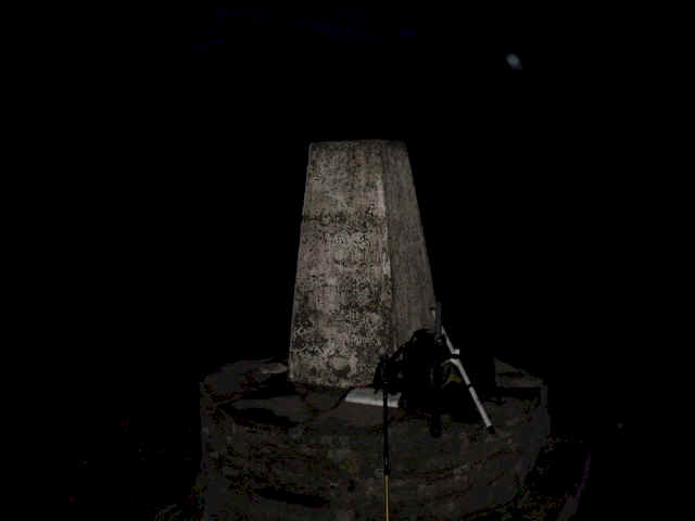 The trig point at Hay Bluff, pictured at night during the descent from Black Mountain WB-001.  This trig lies at a height ASL that is 26m vertically lower than the summit - meaning that you cannot operate SOTA from here - by 1 metre!