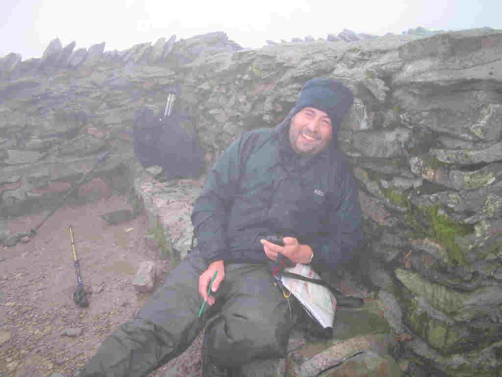 Trying to see the funny side of it all from the Helvellyn summit shelter