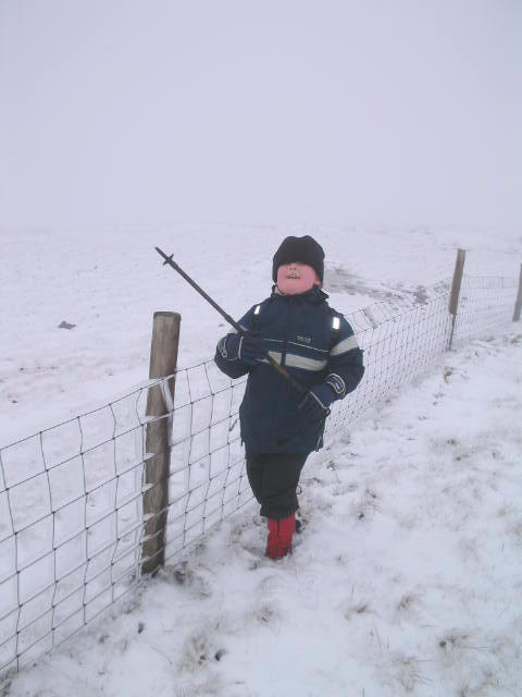 Liam discovers the game of knocking the ice off the fence!