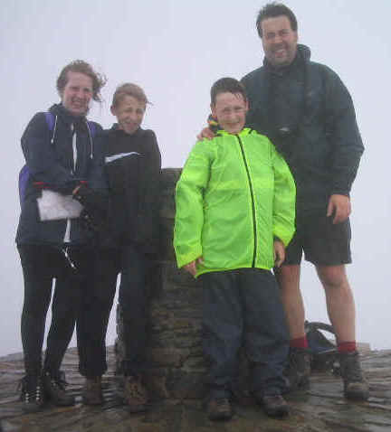 Maggie MW3JAT, Josh MW3EPA, Jimmy & Tom M(W)1EYP at the trig point on Snowdon summit