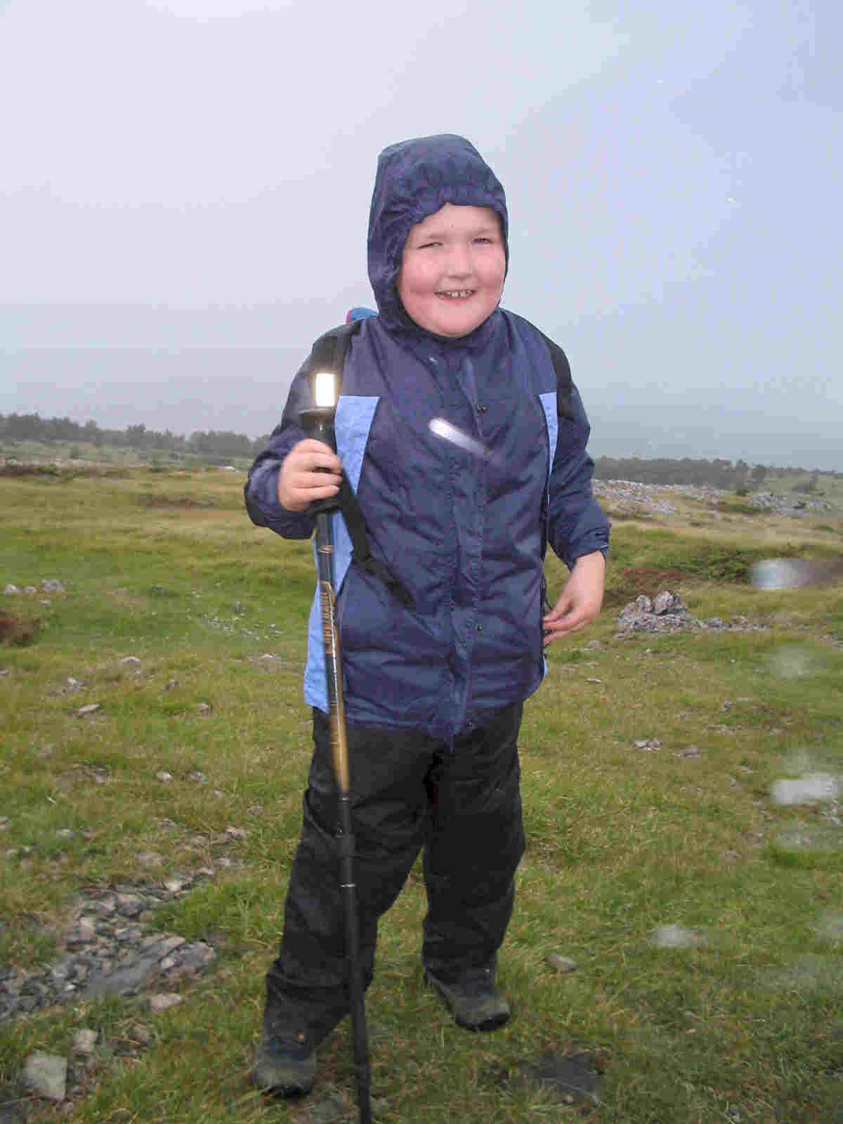 Liam arrives on the summit of Whitbarrow